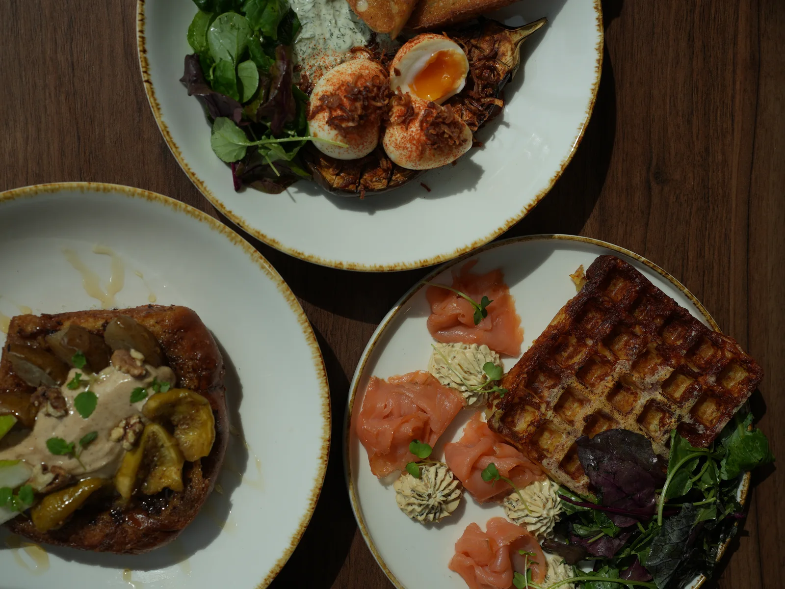 Brunch table with a variety of dishes at Sleepy Bird